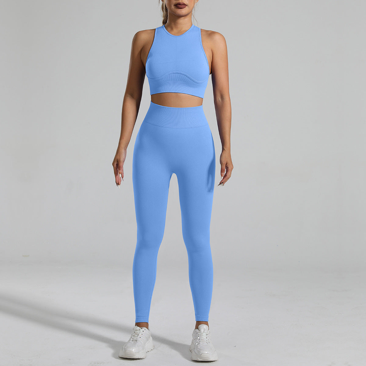 A woman figure, wearing a  Light Blue Tight-Fitting Yoga Set